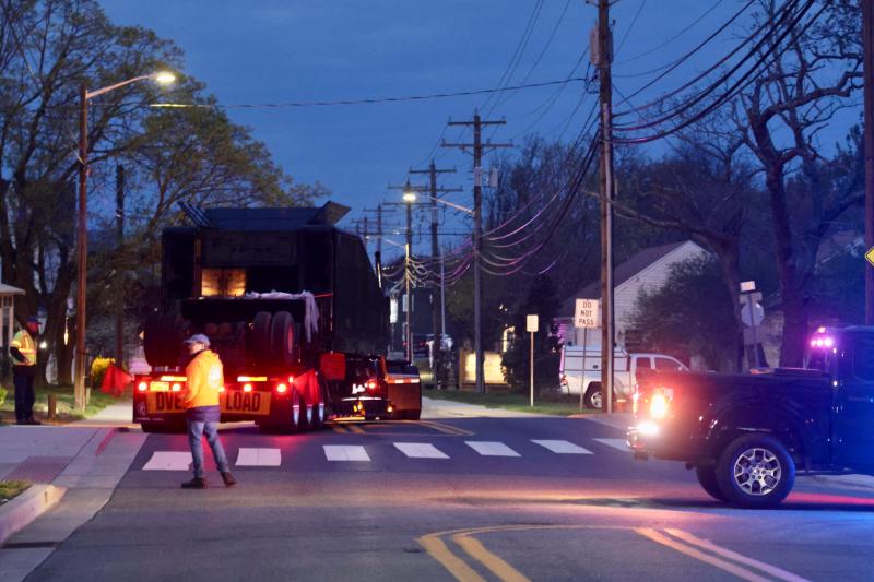 The flatbed truck turns off Kings Highway and backs into Stango Park in the dark. The truck went parallel to the bike trail for its journey to the end of the railroad track.