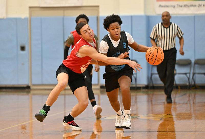 DE South eighth-grade guard Caleb Bonds avoids the reach in by Maryland South eighth-grader Aarian Tucker.