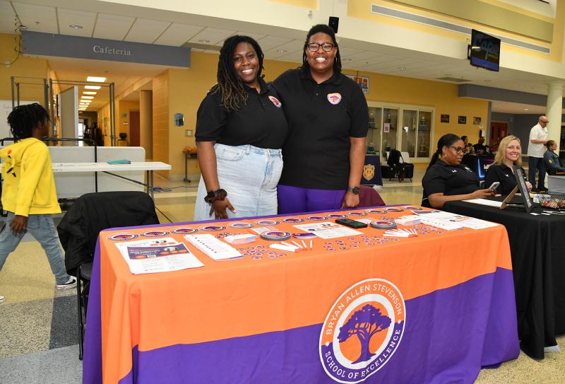 Christina, left, and Chantalle Ashsord represent the Bryan Allen Stevenson School of Excellence at the event.