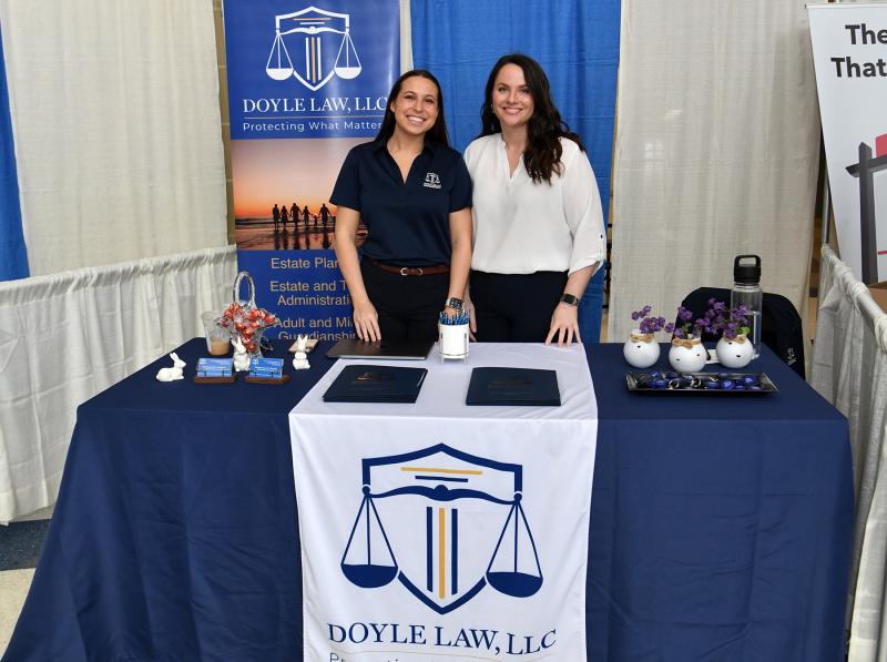 Samantha Mears, left, and Caitlin Murphy of Doyle Law LLC answer questions about protecting one’s home investment.