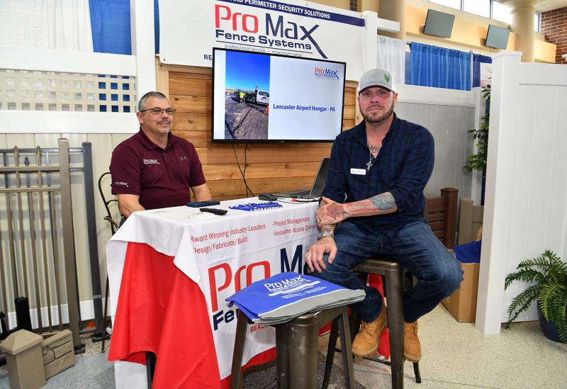 Kerry Schneck, left, and Ryan Kirlin offer advice on protecting property with Pro Max fence systems.