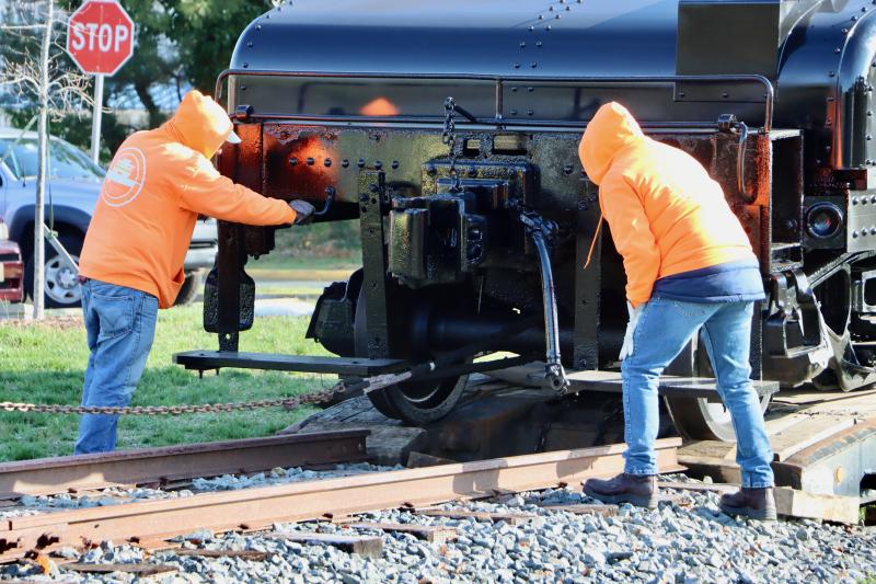 Getting the tender in the right alignment was tricky, but LJRBA members and the moving crew were successful at getting it into position.