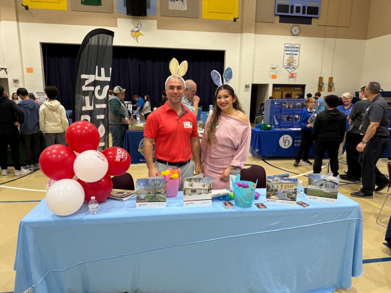 Ready to greet students and talk about real estate careers are Kyle Pohorely, left, and Frannie Esparza of Northrop Realty.