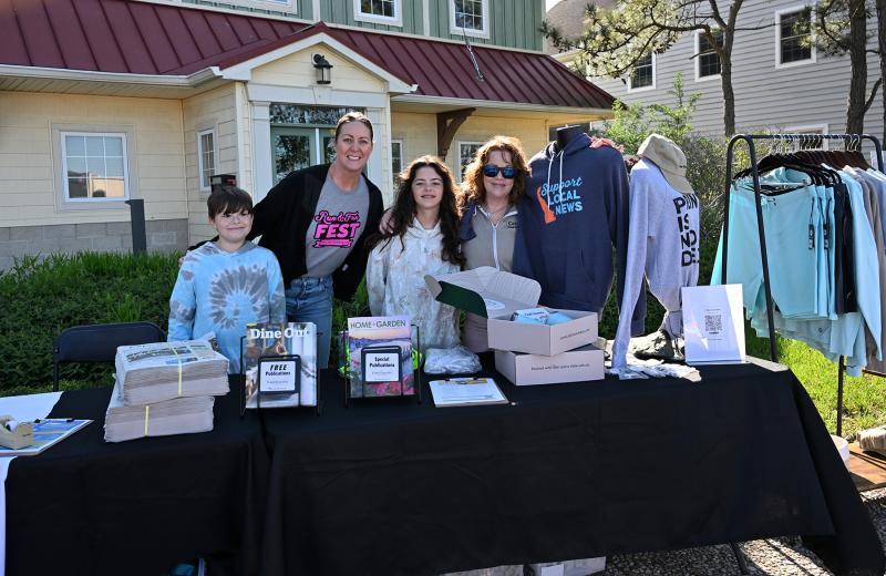 Working the Cape Gazette booth are (l-r) Carter Workman, Lauren and Addy Zaniewski and Kathy McGinty.