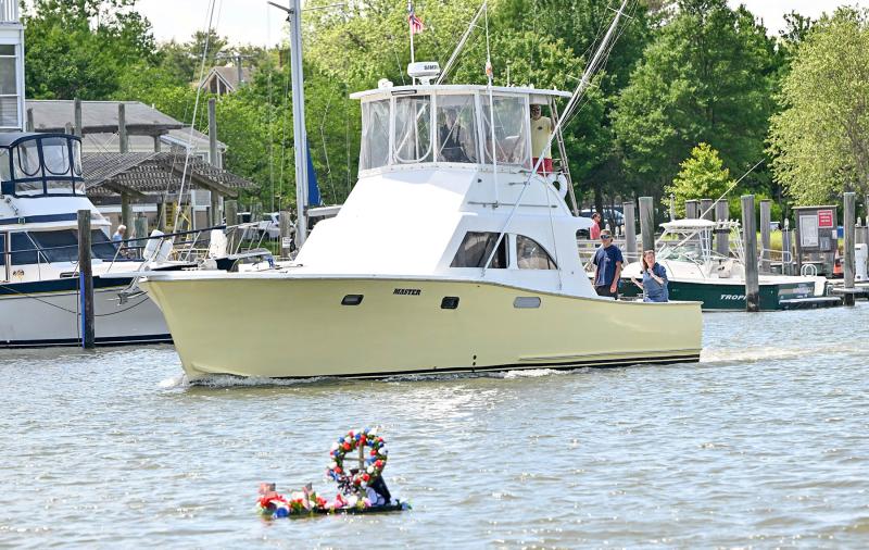 The Master, captained by Michael Cerchio, moves by the wreaths honoring Capt. Dale Parsons and JB Walsh.