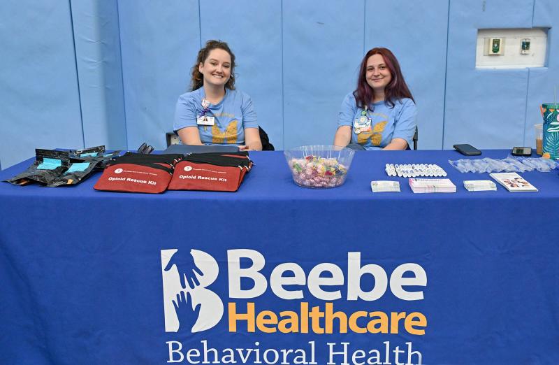 Emily Hains, RN, left, and Maddie Maksymow, peer coach, share information about the Beebe Healthcare Behavioral Health unit.