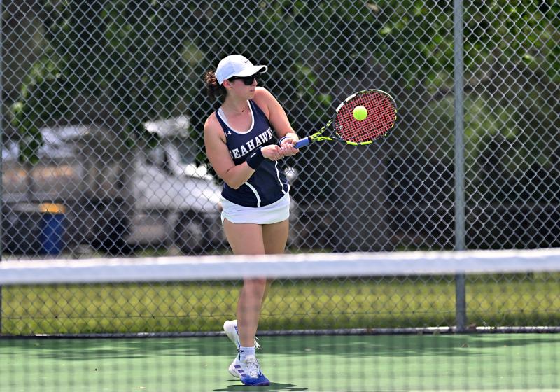 Sussex Academy’s Karina Lopez hits a backhand in her 6-0, 6-2 semifinal loss to Cape’s Abby Hazzard.