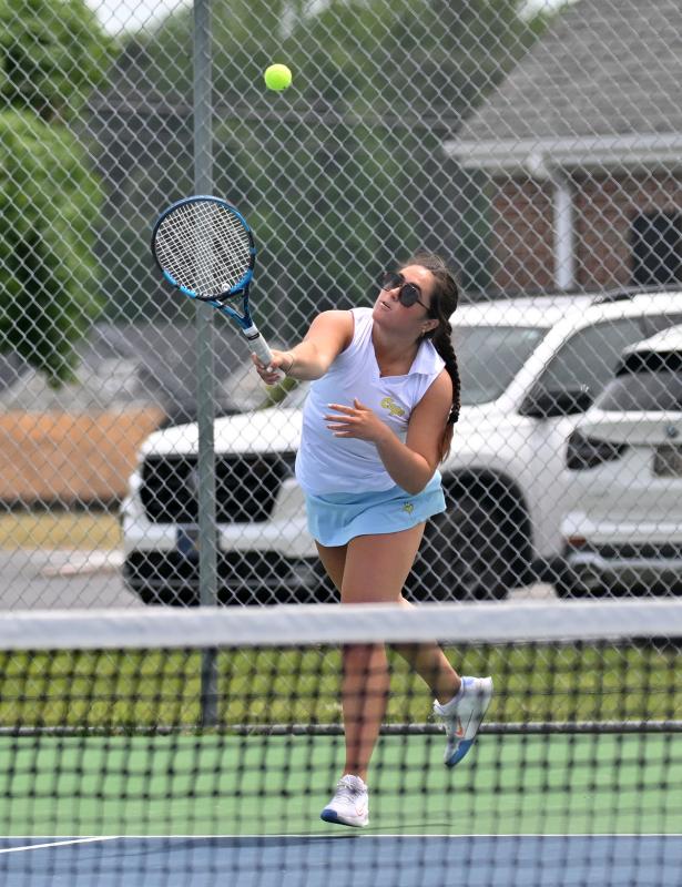 Cape junior first-doubles player Mya DiSabatino slams a serve in the win over Polytech’s Abigail Jones and Brynleigh Sheehan, 6-1, 6-0 to take third place.
