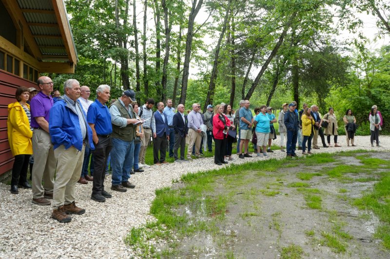Delaware elected officials, volunteers, community members, board members, project donors and others listen to Aimee Isaac, vice chair of the Delaware Center for the Inland Bays board of directors, speak at the ribbon-cutting ceremony for the new James Farm Ecological Preserve education campus.
