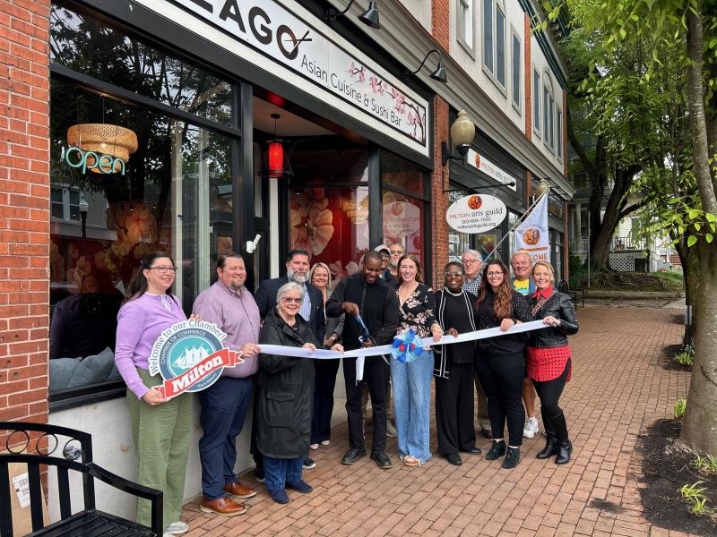 Taking part in the ribbon cutting are (l-r) Jessica Velasquez-Schlegel, Kevin Thompson, Vice Mayor Lee Revis-Plank, Councilman Scotty Edler, Town Manager Kristy Rogers, Preston Russell, Nitan Soni, Mayor John Collier, Caitlin Russell, Wanda Russell, Councilman Robert Gray, Erin Frederick, Tom Jones and Laura Bartus. RYAN MAVITY PHOTO