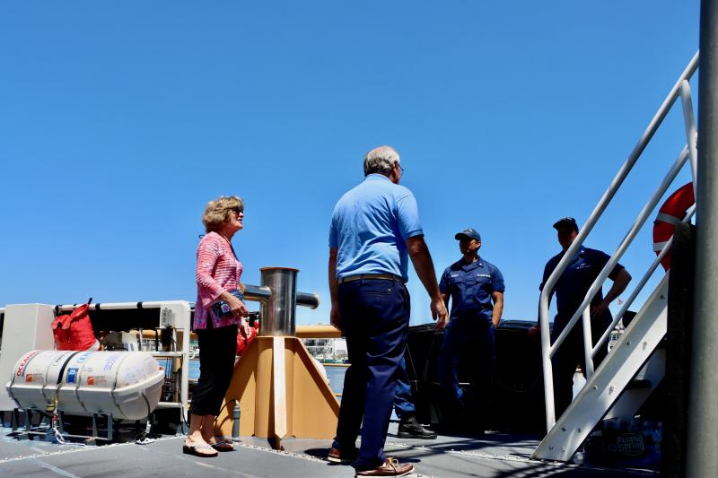 Judy and Pat Lynch talk with the crew of the U.S. Coast Guard cutter Heron during Maritime Day. Pat is a member of the Overfalls Foundation.