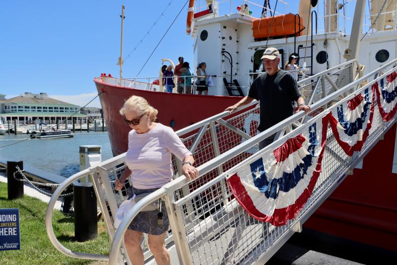 Sharon and Josh Blumental of Lewes make their way down the Lightship Overfalls ramp after a visit to the historic ship on Maritime Day May 17. They said they always learn something new when they visit. The annual event is a celebration of Lewes’ nautical heritage and the Overfalls’ season kickoff. BILL SHULL PHOTOS