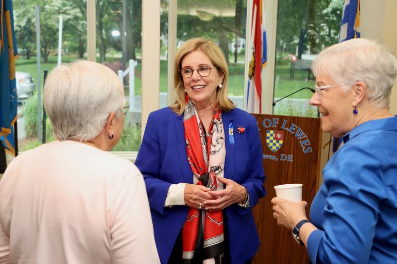 Amy Marasco chats with Lewes Tree Commissioner Mardi Thompson, left, and former Lewes Councilwoman Candace Vessella.