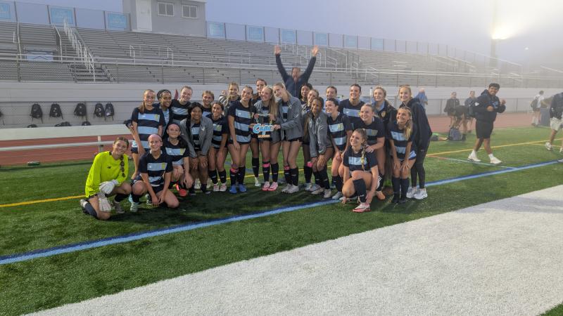 Following the game, the team posed with their Cape soccer chain as their coach Patrick Kilby photobombed the picture with a starburst.