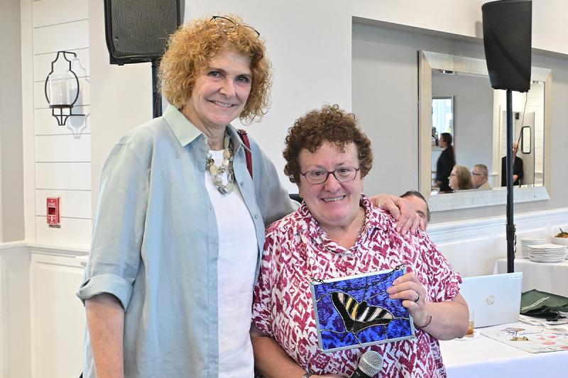 SPC board member Mary Boggi, right, presents honoree Alison White with her Sussex Preservation Coalition Champions Award.