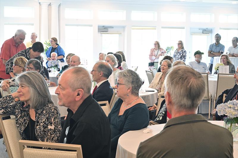 Diners listen as Delaware Center for the Inland Bays Executive Director Christophe Tulou talks about his organization’s mission to preserve, protect, and restore Delaware's Inland Bays and their watershed.