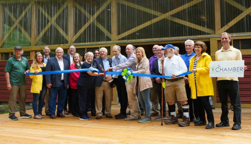 Board members and volunteers from the Delaware Center for the Inland Bays join several elected officials, folks from the Bethany-Fenwick Area Chamber of Commerce and community members in cutting the ribbon for the new education campus at James Farm Ecological Preserve in Ocean View May 30. ELLEN MCINTYRE PHOTOS