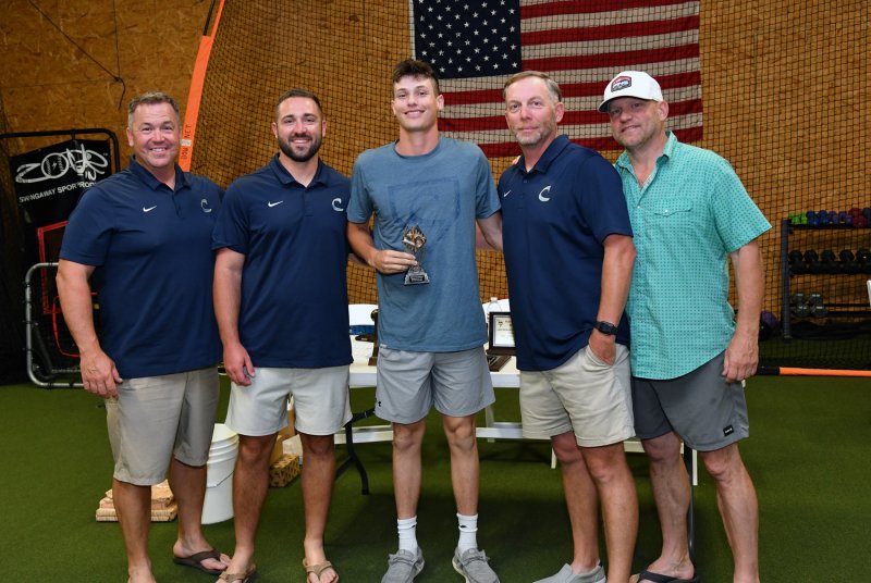 Rising senior Emmett Wheatley, center, receives the Rookie of the Year award. Shown are (l-r) coach Ben Evick, assistant coach Seth Brosius, Wheatley, assistant coach Dave Gordon and assistant coach Matt Griswold.