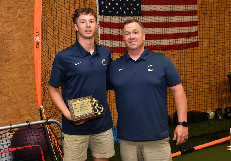 Cape coach Ben Evick, right, presents the MVP award to Jase Mitchell. Mitchell will be attending the University of Kentucky in the fall.