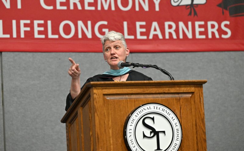 Delaware Director of Adult Education Maureen Whelan speaks to graduates on the importance of a high school diploma.