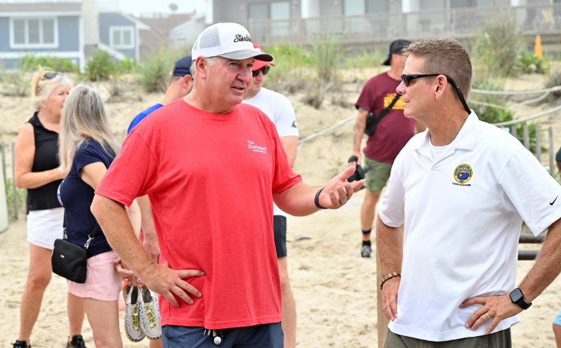 The Starboard owner Steve “Monty” Montgomery, left, goes over the day’s events with Dewey Town Manager Bill Zolper.