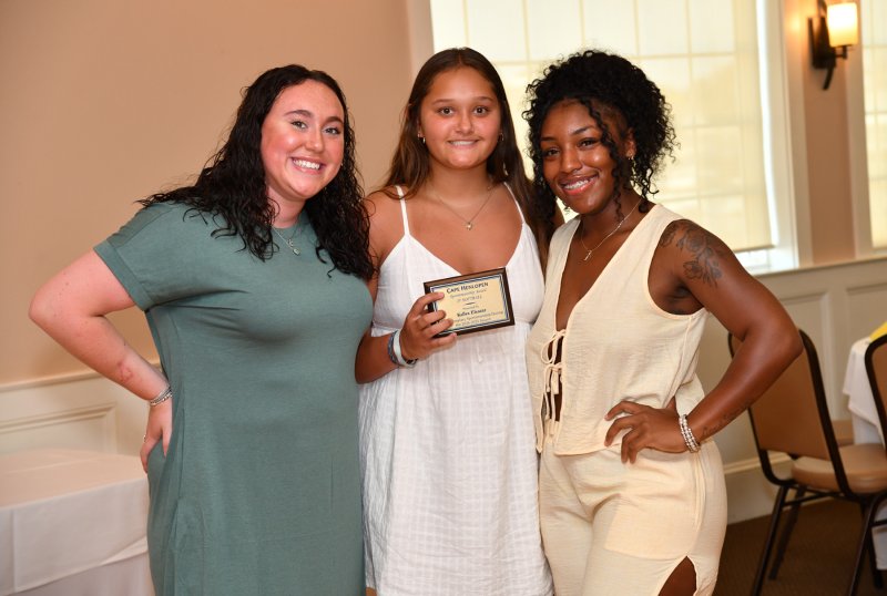 JV coaches Kelsey Huling, left, and Kaniah James present the JV Sportsmanship Award to Kallea Eleazar.