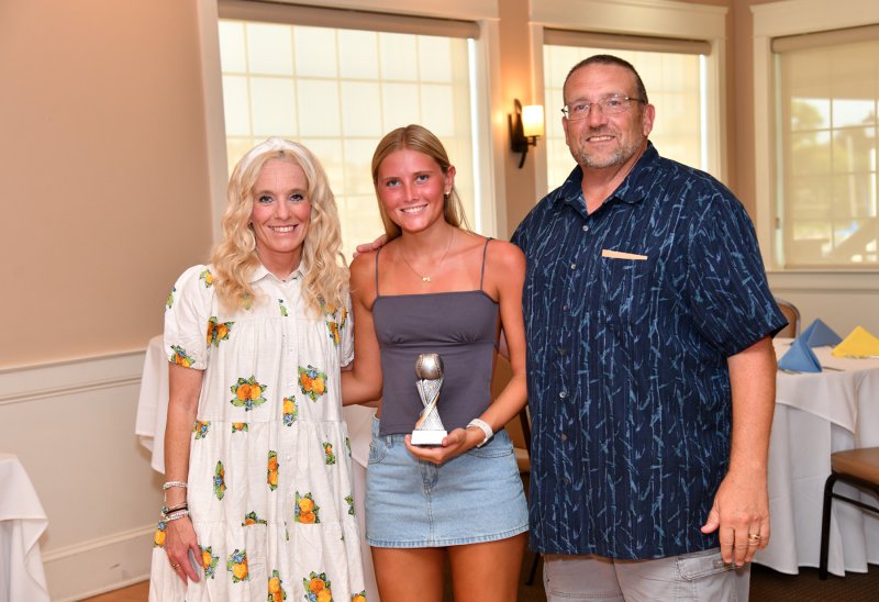 Bri Windish receives the Most Improved Player Award from assistant coach Allison Sullivan, left, and coach Mike Tkach.