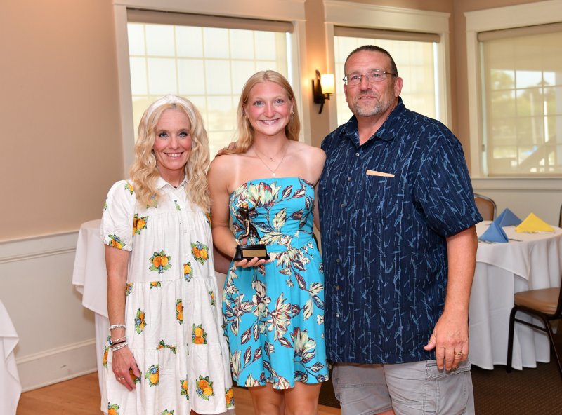 Ava Calciano receives the Offensive Player of the Year from assistant coach Allison Sullivan, left, and coach Mike Tkach.