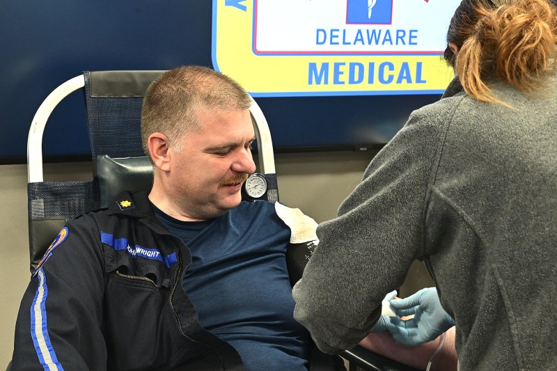John Wright, manager of quality and standards for Sussex County EMS, gets his blood drawn by Chelsea Akers, supervisor for the Blood Bank of Delmarva.