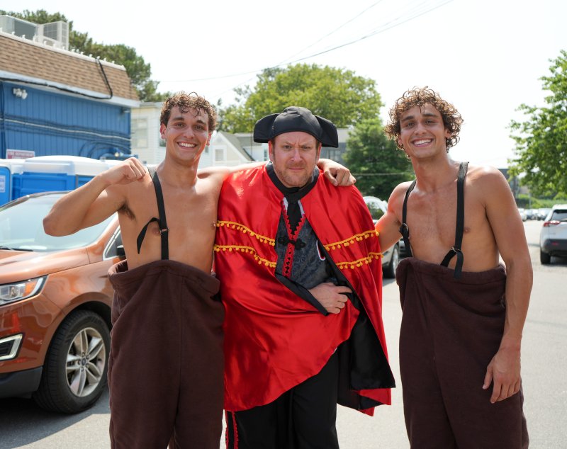 This year’s matador, Ryan Cormier, stands with twin brothers Daniel, left, and Alex Shives, who were in the bull costume, after the bull fight.