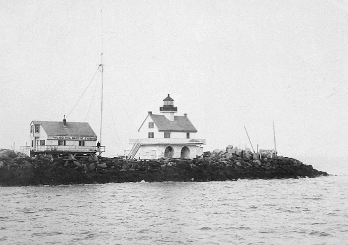 The Strickland Lighthouse, right, stands next to the Philadelphia Maritime Exchange building on the inner breakwater. SOURCE: U.S. COAST GUARD