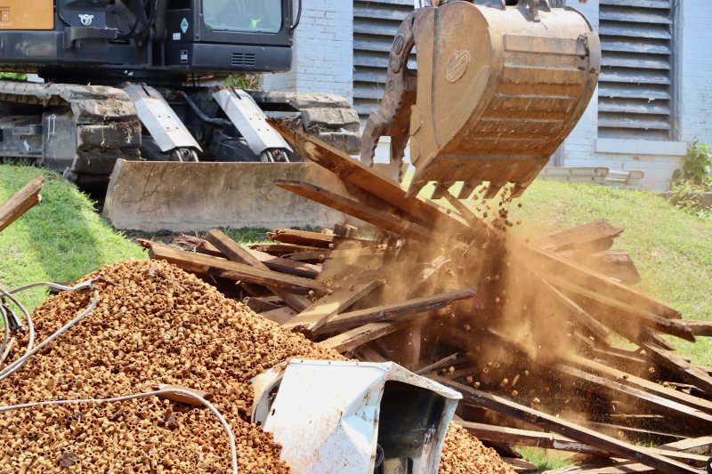 As an excavator removed the old structure, many thousands of ceramic pellets used in the water deaerating system came flying out and quickly piled up.