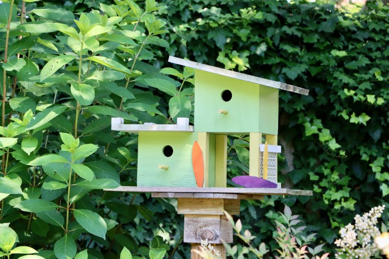 A split-level bird house is one of the many little accessories all around the yard at 9 Drake Knoll.