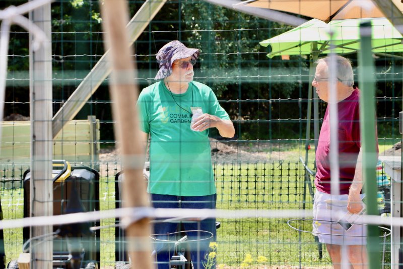 Dan Howard, who is on the Lewes Community Garden’s build committee, chats with Don Sholl about the work the volunteers do.