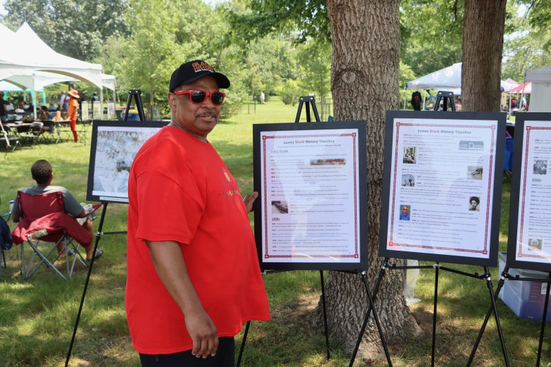 Darryl Daisey, chair of the Lewes African American Heritage Commission, stands in front of the Lewes Black history timeline he helped create.