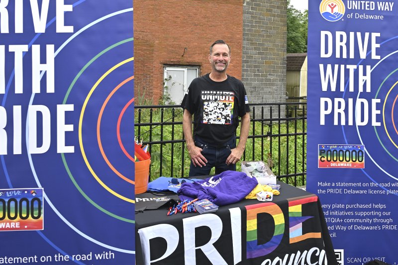 Dan Cruise, chief operating officer with United Way of Delaware, shows off Delaware’s new Pride license plates.