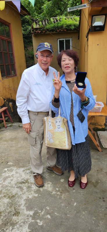 Larry Kelley, left, with the granddaughter of the Taoist priest who hid a Raiders crew behind his altar. Japanese soldiers came looking for the Americans. They nearly beat the priest to death trying to force him to reveal where they were.