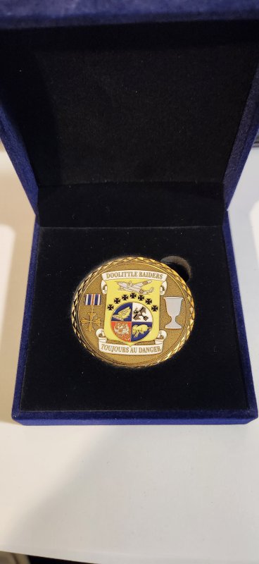 Larry Kelley brought Doolittle Raiders coins to give to the Chinese people and families he met during the shooting of the Doolittle Raiders documentary in China.