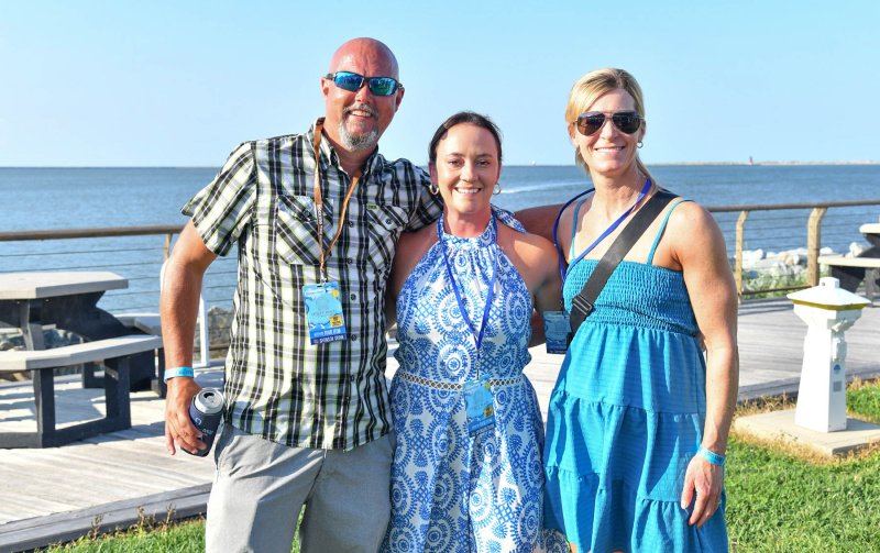House District 20 candidate Nikki Miller, center, gets together with friends Dave and Cora O’Donnell at the benefit.
