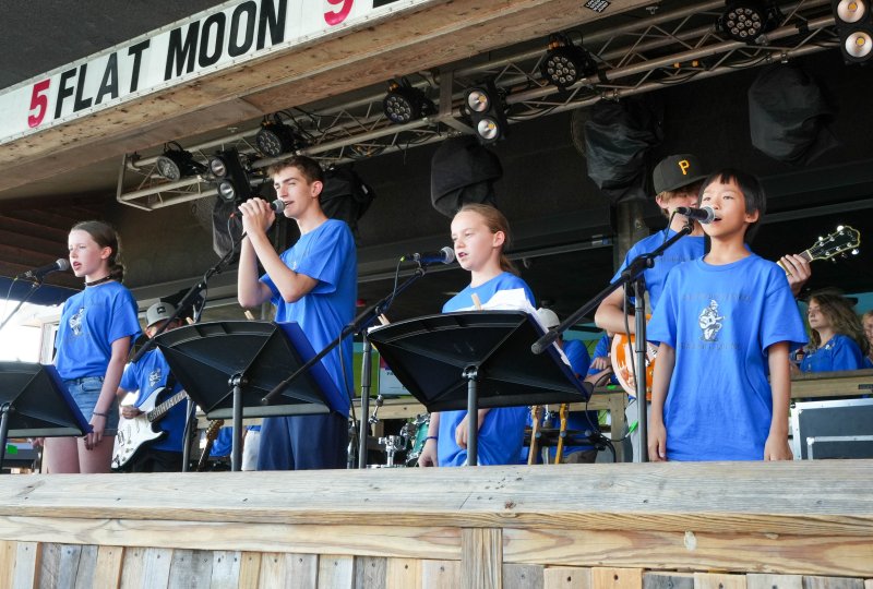 The campers perform a song. Shown in front singing are (l-r) Ava Kaskey, Kellan Lepoakil, Hazel Marshall and Olivia Sun. Behind them are Joseph Bradshaw and Reed Snyder.