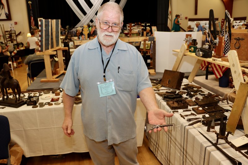 Ed Donaldson is an expert on old door locks and hardware. He came to the Bethel show for the first time. Donaldson is holding an iron grafting tool from 1700.