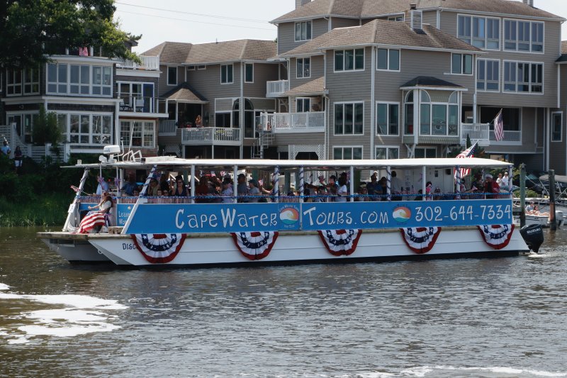 The Cape Water Taxi boat and Capt. Dave Green cruises past the judges who were on the dock at Fisherman’s Wharf.