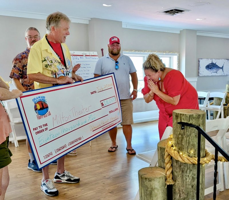 Delaware Seashore Parrothead Club’s G. Carleton Foster presents a check for $18,000 to Milton Theatre’s Jaycee Brittingham. Also shown are Jimmy Kroon and Bill Brittingham.