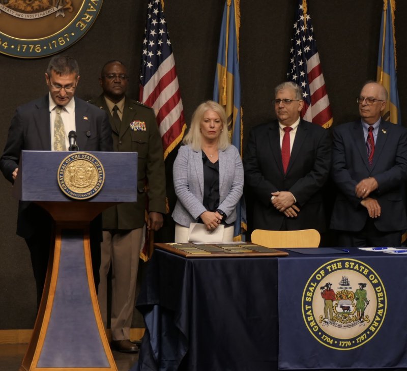 Gov. Matt Meyer signed several bills July 23 to help veterans and miltiary families in the state. Pictured are (l-r) Meyer; Maj. Gen. James Benson, adjutant general of the Delaware National Guard; Sen. Nicole Poore, D-New Castle; Sen. Spiros Mantzavinos, D-Westgate Farms; and Rep. Danny Short, R-Seaford. OFFICE OF THE GOVERNOR PHOTO