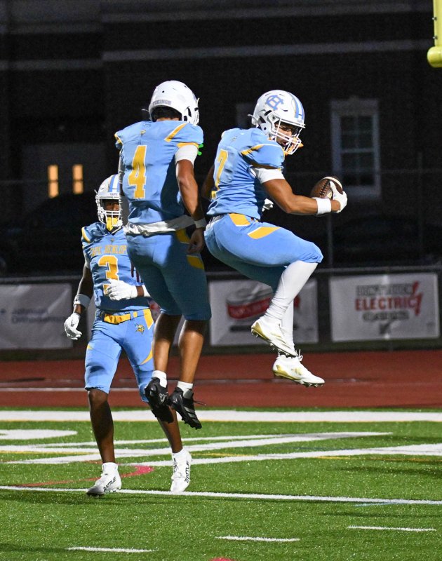 Cape senior Anthony Francis, right, gets major air to celebrate his touchdown with quarterback Jameson Tingle.
