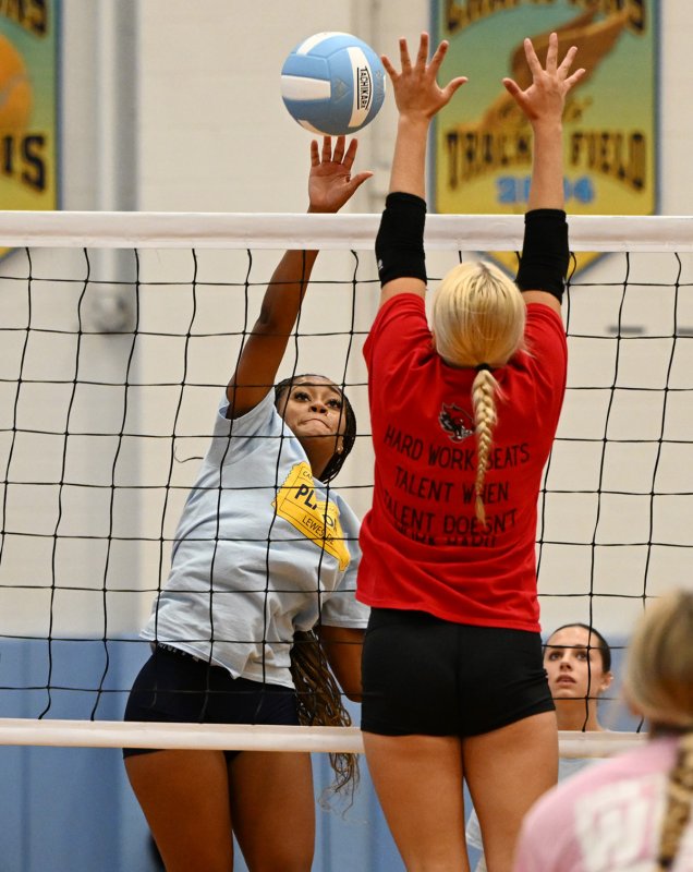 Cape’s Anejah Johnson-Grace powers past Conrad block attempt.