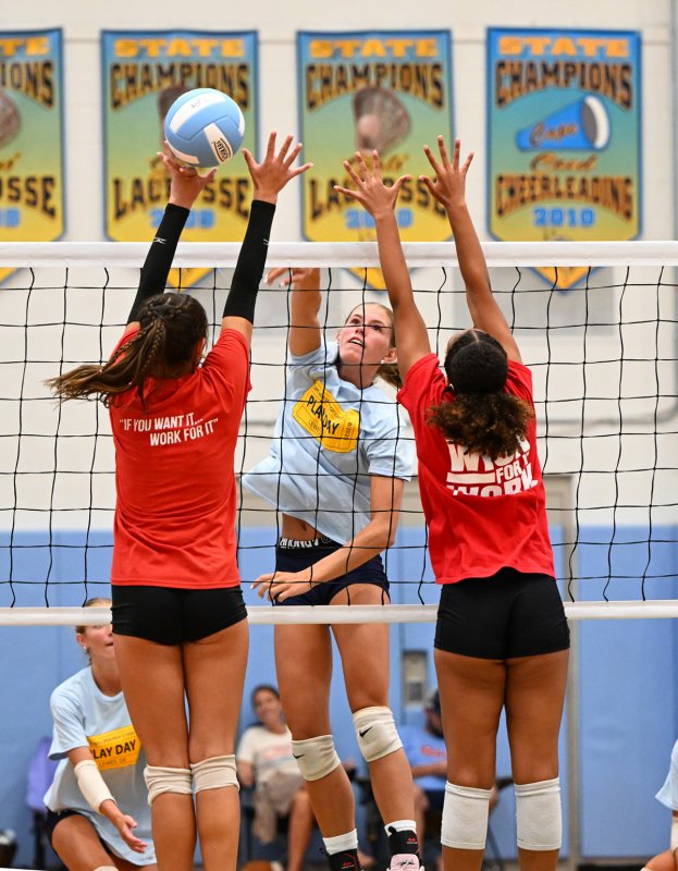 Senior Amalia	Fruchtman pounds a shot through a Conrad block attempt.