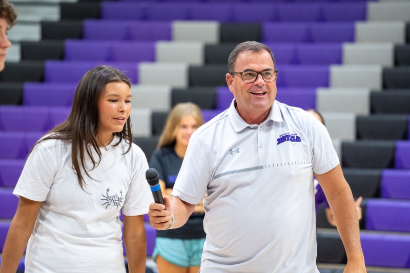Leading new students through an obstacle course during Delmarva Christian orientation are freshman Capri Sen, left, and Matt McGinnis, director of athletics. SUBMITTED PHOTOS