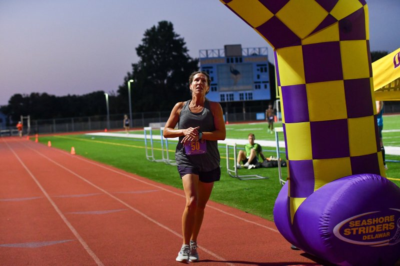 Cindy Price Washeck runs 6:55 to win the 50-59 race. She is a former Cape cross country state champion who now lives in St. Louis, Mo.