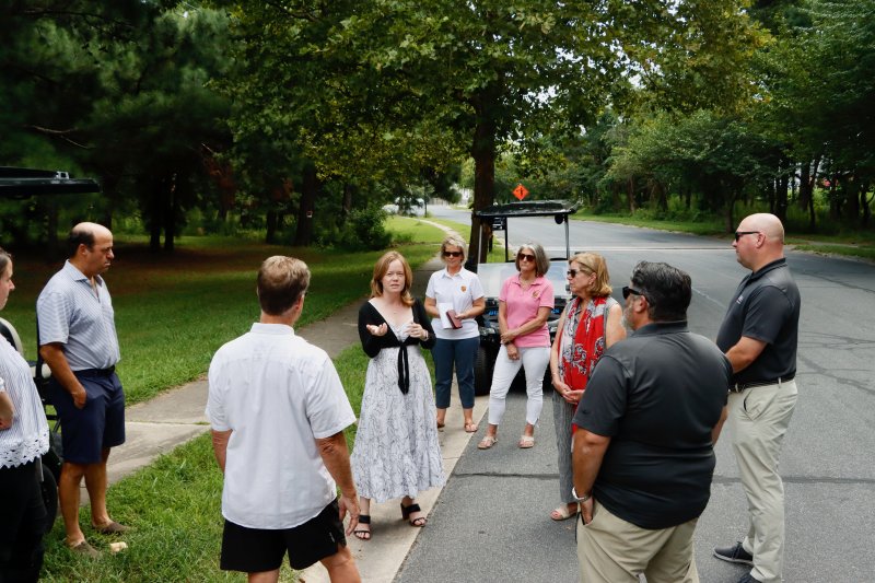 Lt. Gov. Kyle Evans Gay, center, talks with Lewes city officials at the Fourth Street Preserve July 30. BILL SHULL PHOTOS